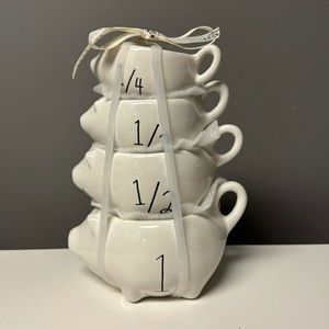 Rae Dunn pig-themed 4-piece measuring cup set from the 2024 collection